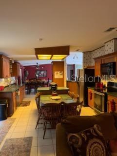 13921 Pine Meadow Road Kathleen, FL 33849 - Photo 8 of 25 a view of a kitchen and dining area