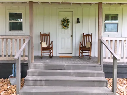 a view of staircase with white walls and a window