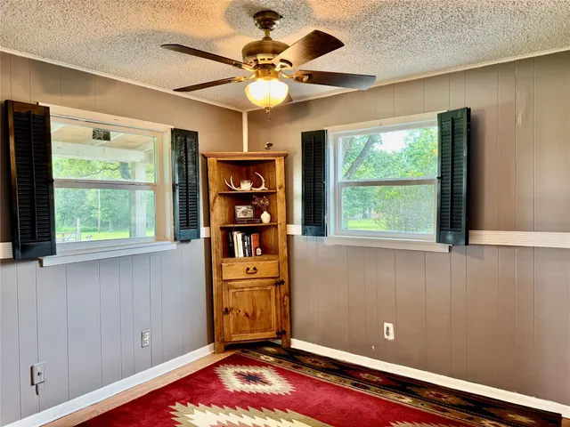 a view of workspace with window and cabinet