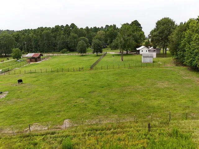 a view of a golf course with chairs