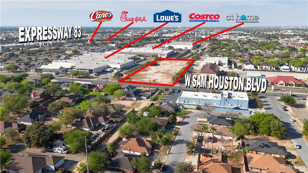 1206 West Sam Houston Boulevard Pharr, TX 78577 - Photo 5 of 8 a city street filled with lots of traffic and parked cars