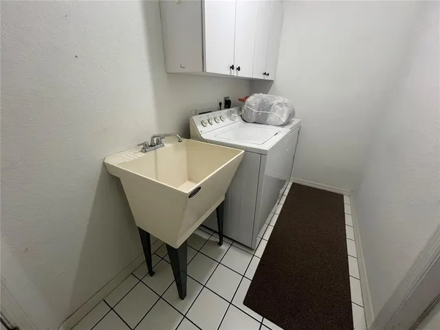 a utility room with washer and dryer