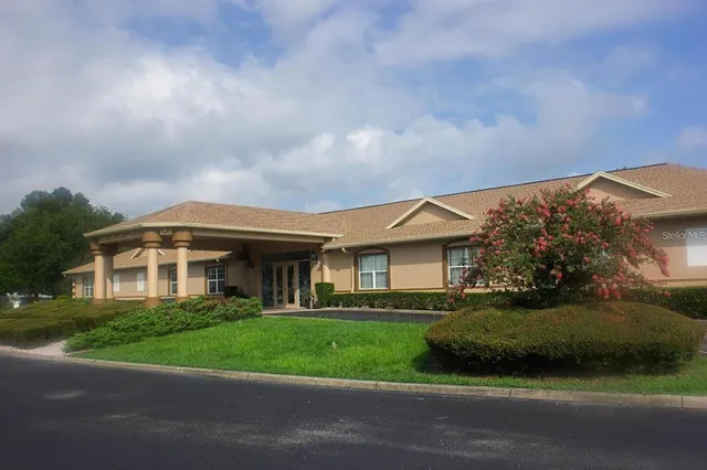 a view of a swimming pool with a patio