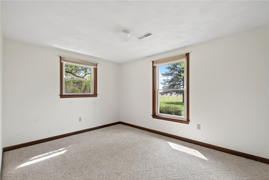 7988 McCool Road Greenville, OH 45331 - Photo 18 of 50 This spacious room offers ample natural light and verdant views, perfect for peaceful living.