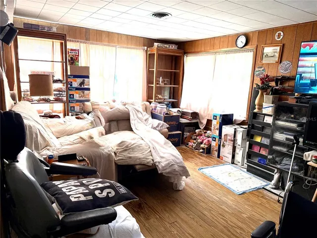 a bedroom with furniture and a window