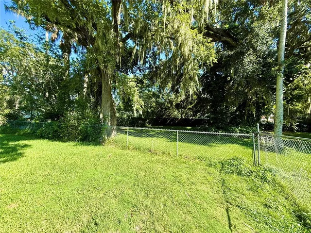 a backyard of a house with lots of green space