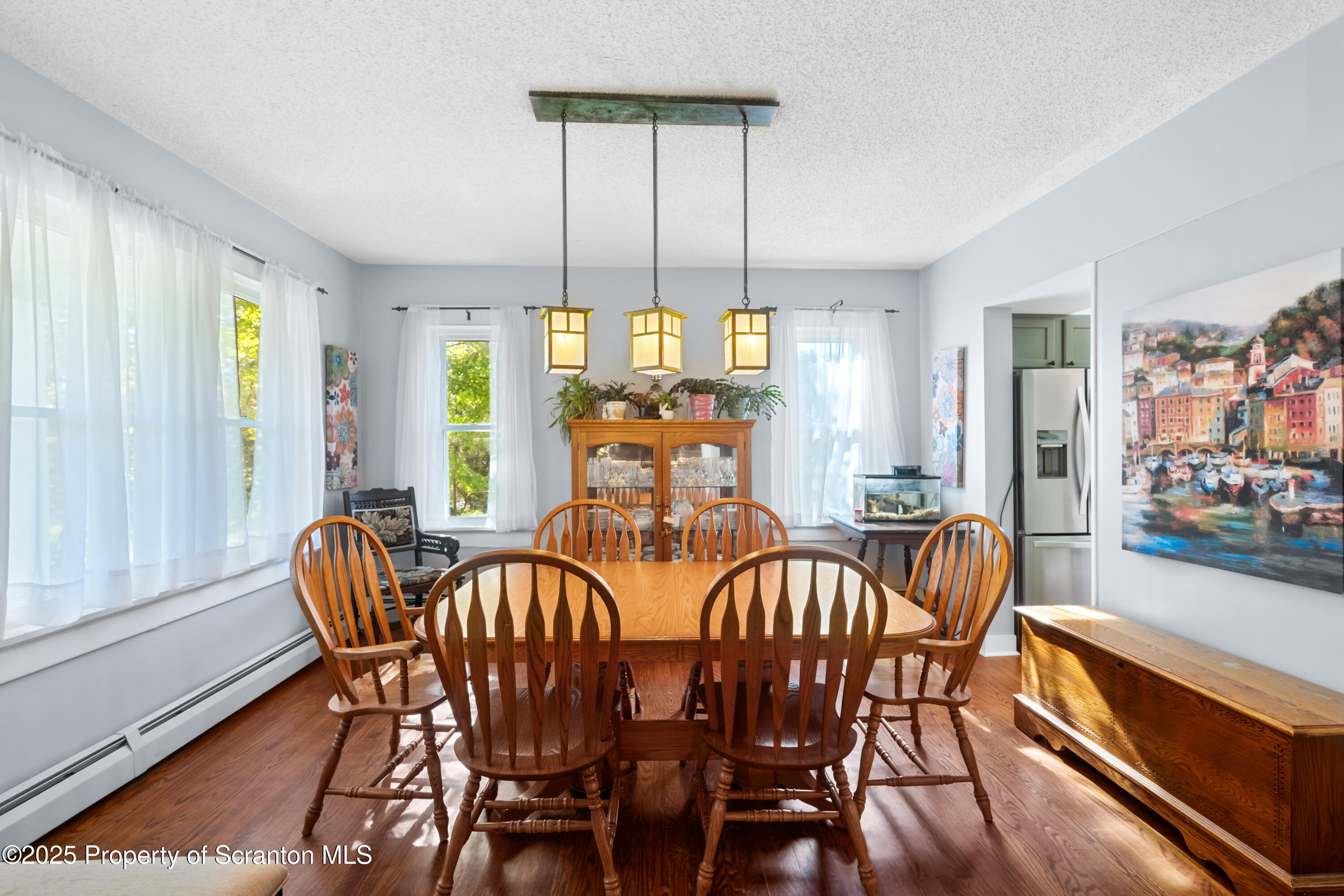 367 Carbondale Road Clarks Summit, PA 18411 - Photo 13 of 66 a view of a dining room with furniture window and wooden floor