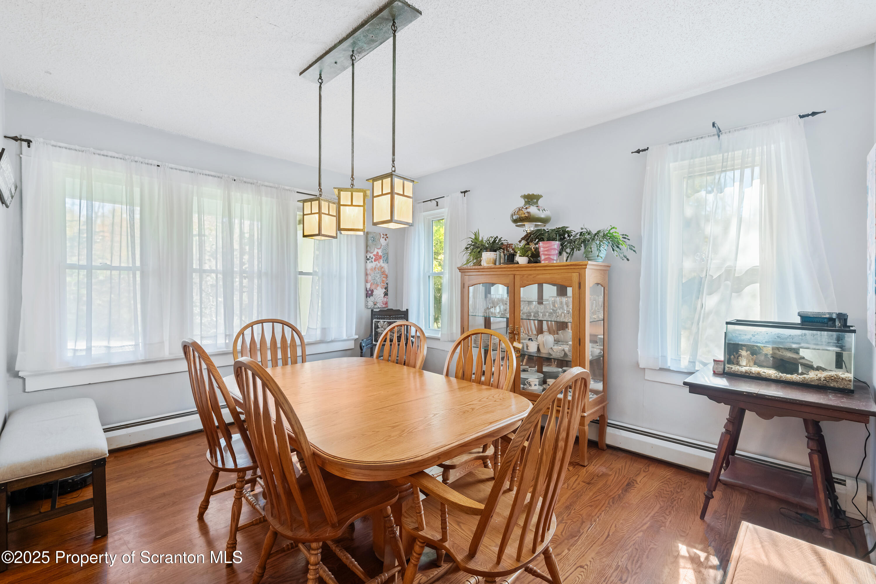 367 Carbondale Road Clarks Summit, PA 18411 - Photo 15 of 66 a view of a a dining room with furniture window and wooden floor