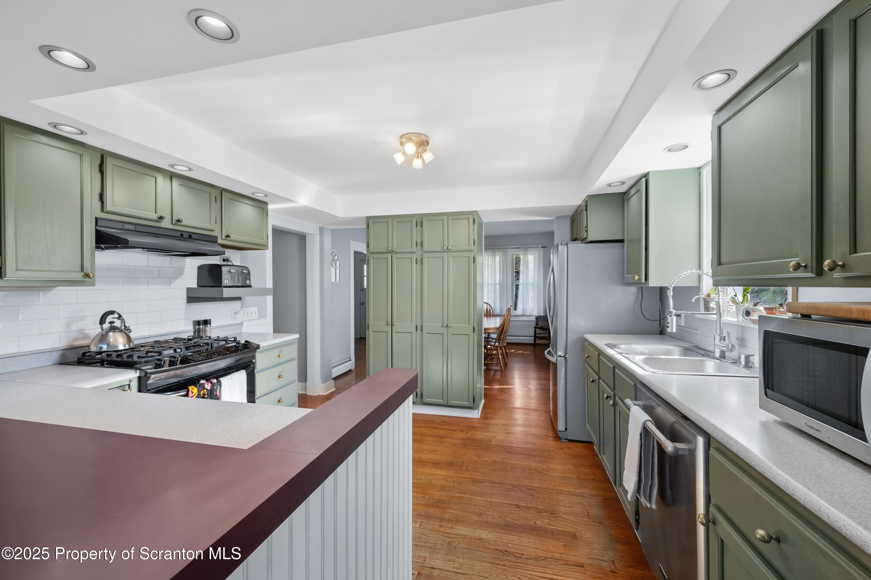 367 Carbondale Road Clarks Summit, PA 18411 - Photo 17 of 66 a kitchen with stainless steel appliances granite countertop a sink stove and cabinets