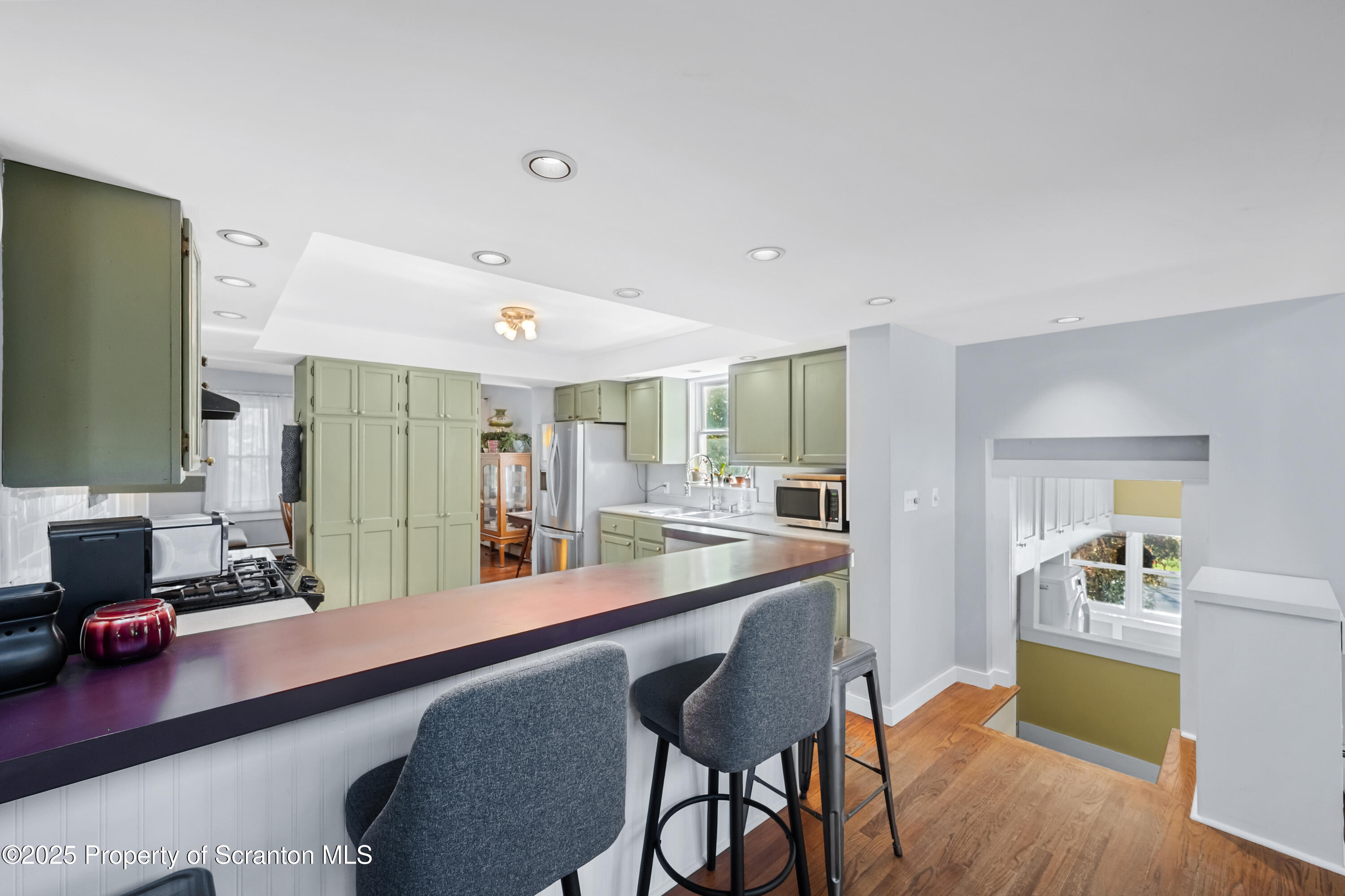 367 Carbondale Road Clarks Summit, PA 18411 - Photo 19 of 66 a dining hall with stainless steel appliances granite countertop a sink and dishwasher with wooden floor