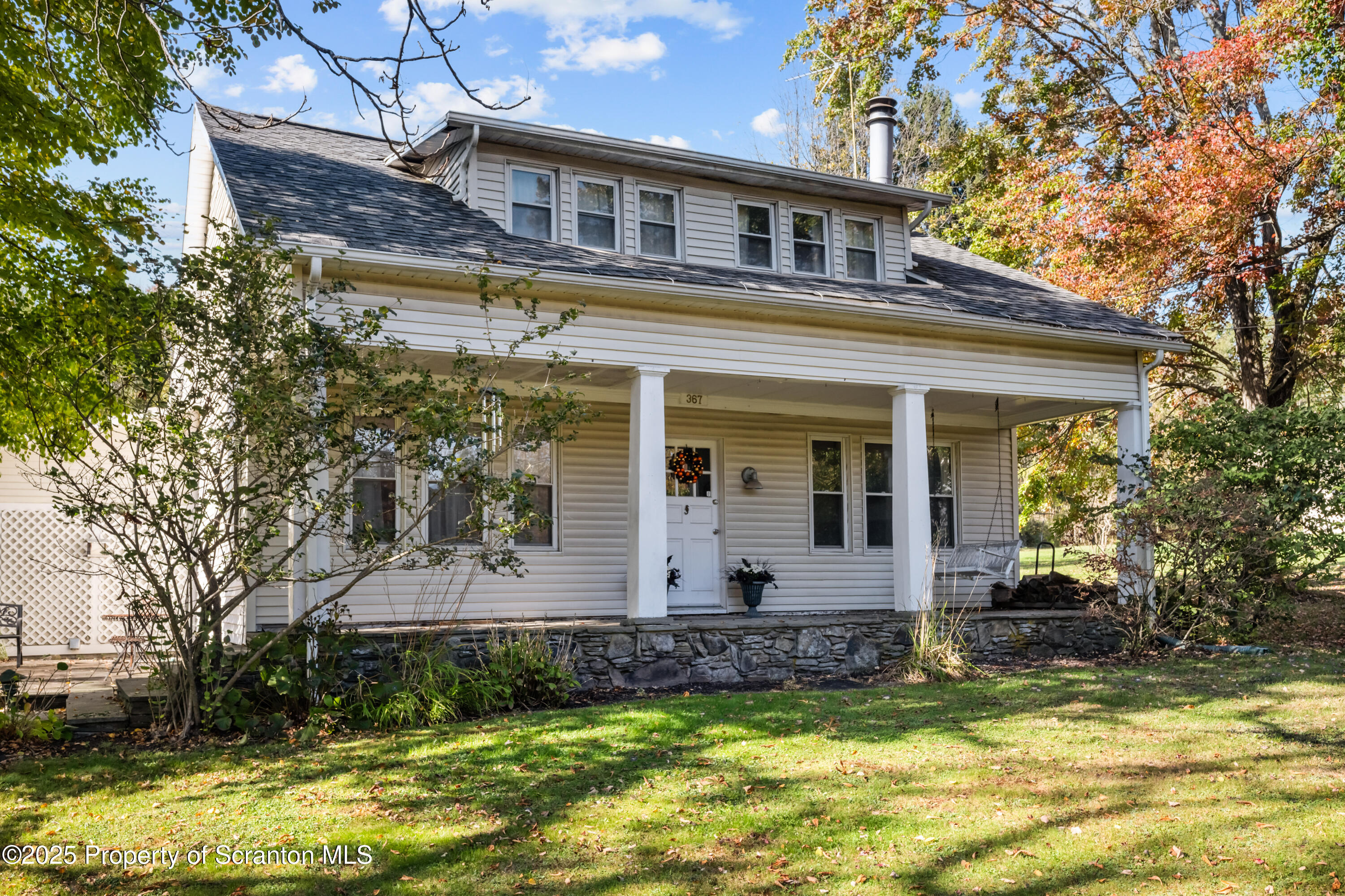 367 Carbondale Road Clarks Summit, PA 18411 - Photo 3 of 66 a front view of house with a garden