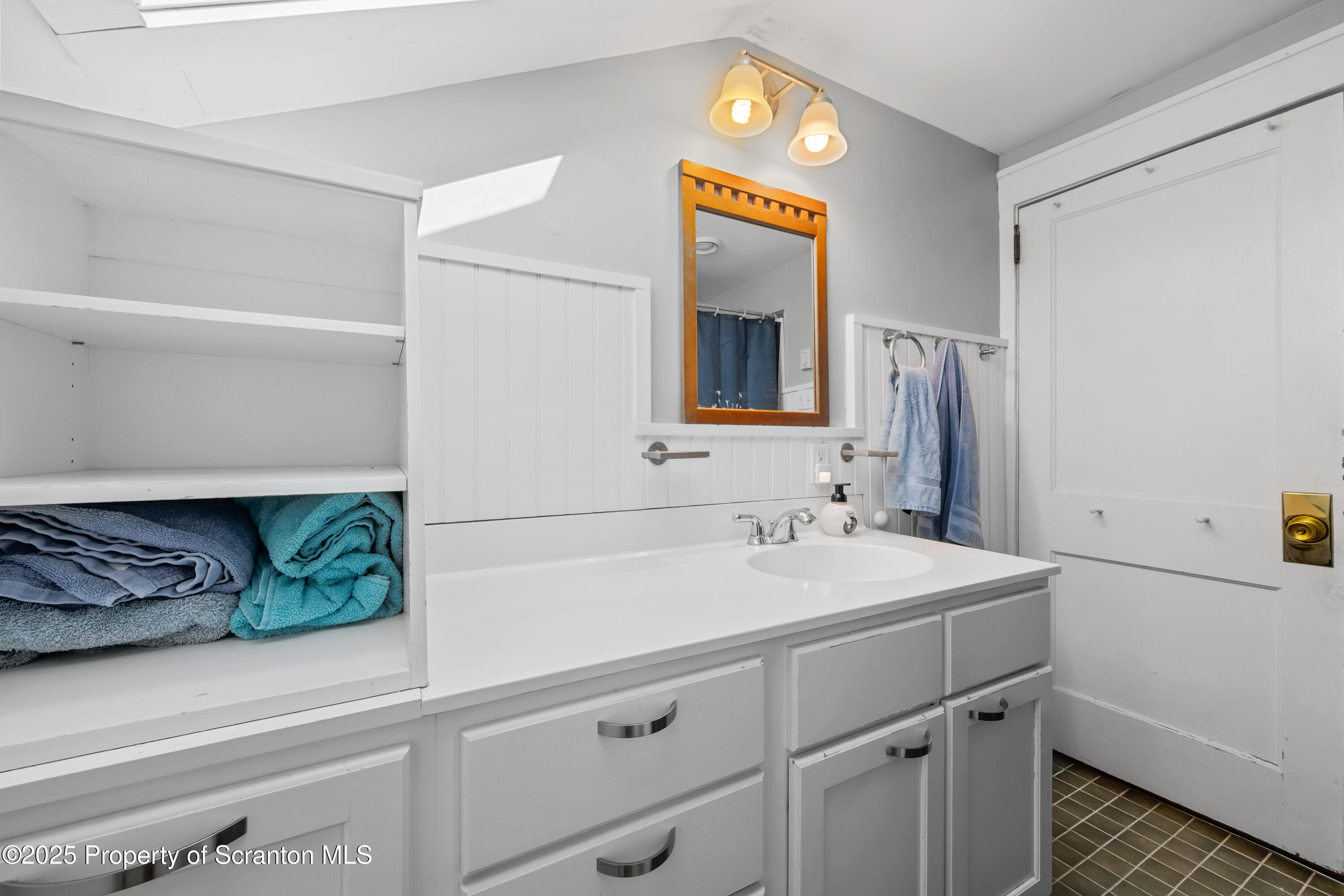 367 Carbondale Road Clarks Summit, PA 18411 - Photo 31 of 66 a bathroom with a sink and a mirror