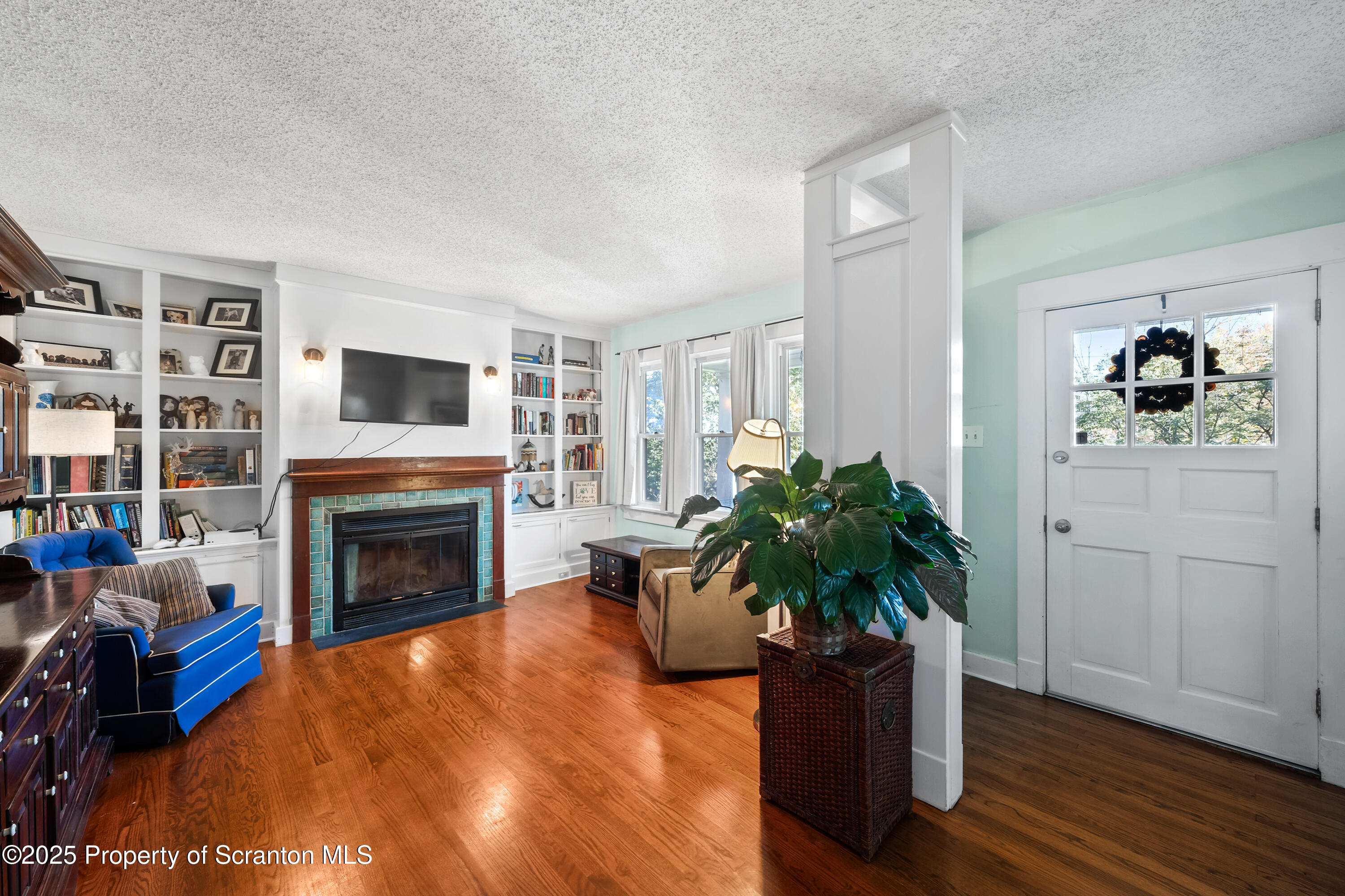367 Carbondale Road Clarks Summit, PA 18411 - Photo 9 of 66 a living room with furniture and a fireplace