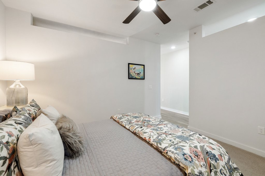 1900 Barton Springs Road, Unit 5009 Austin, TX 78704 - Photo 19 of 35 A comfortable bedroom featuring recessed lighting and a ceiling fan for optimal airflow.