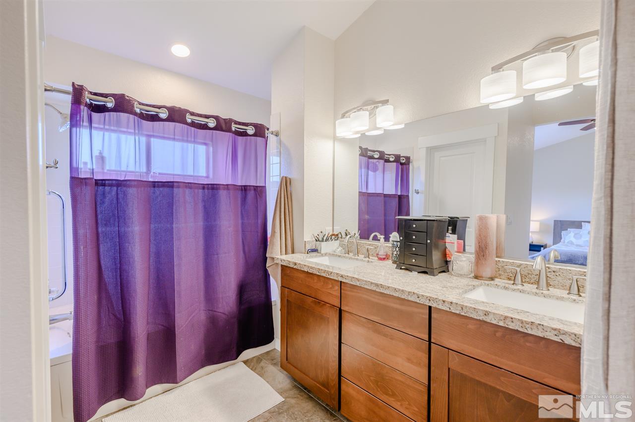 1844 Quail Run Road Reno, NV 89523 - Photo 11 of 15 a bathroom with a granite countertop sink and a mirror