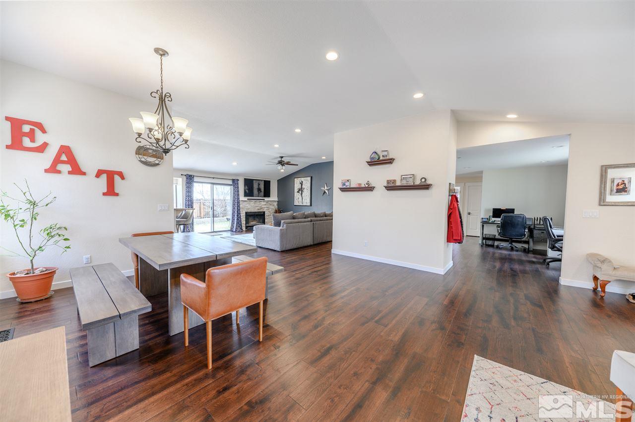 1844 Quail Run Road Reno, NV 89523 - Photo 4 of 15 a living room with furniture and a chandelier