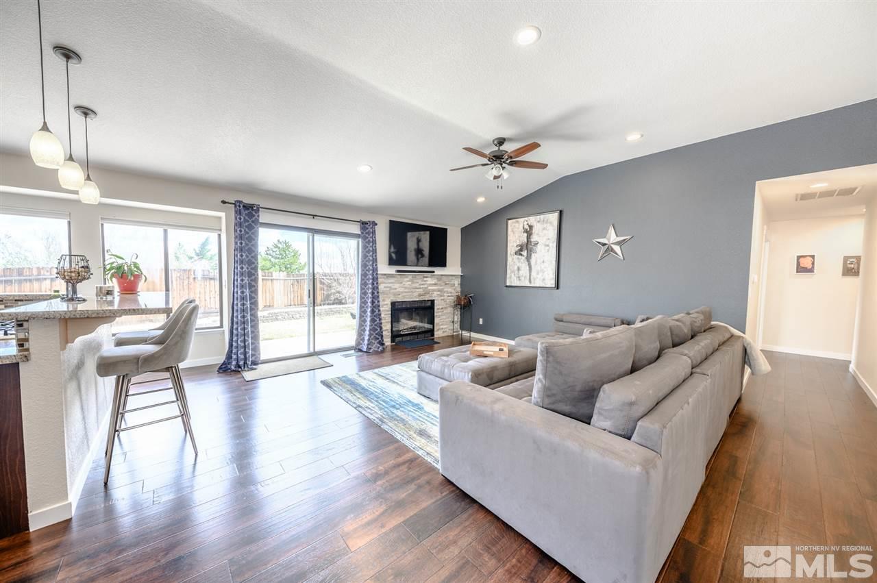1844 Quail Run Road Reno, NV 89523 - Photo 5 of 15 a living room with furniture and a wooden floor