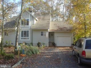 131 Sandyhook Road Ocean Pines, MD 21811 - Photo 1 of 7 a view of a house with a yard and sitting area