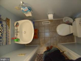 131 Sandyhook Road Ocean Pines, MD 21811 - Photo 5 of 7 a bathroom with a sink mirror and vanity