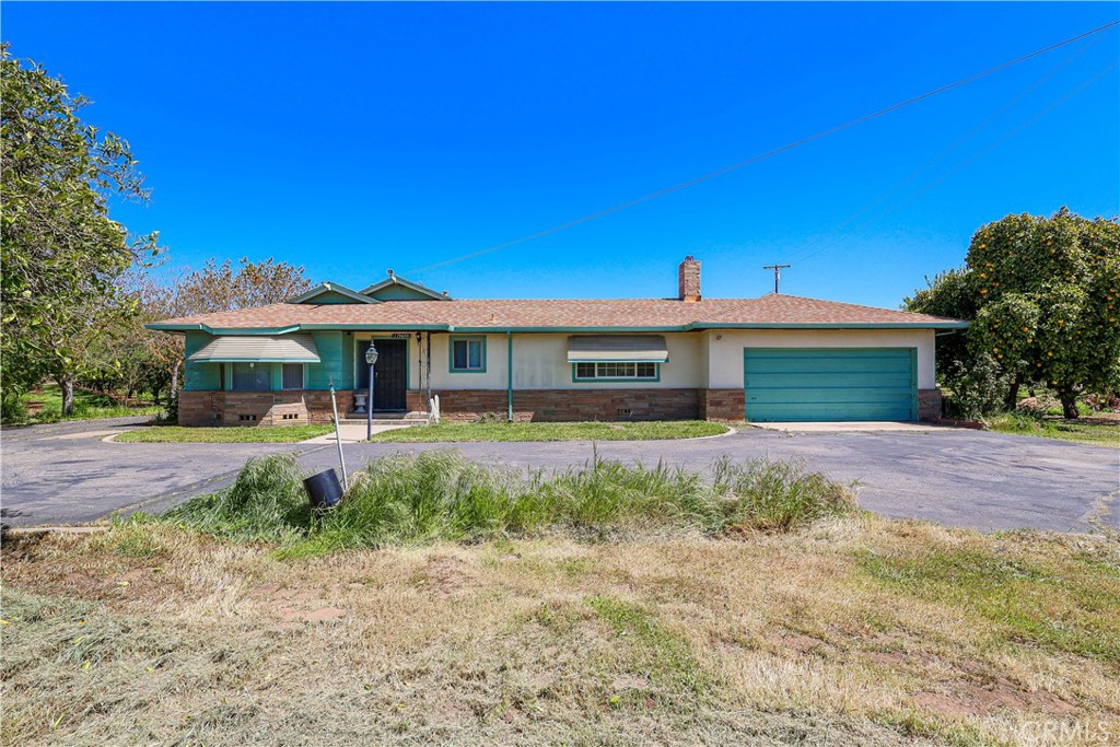 19688 Santa Fe Road Escalon, CA 95320 - Photo 12 of 13 a front view of a house with a yard