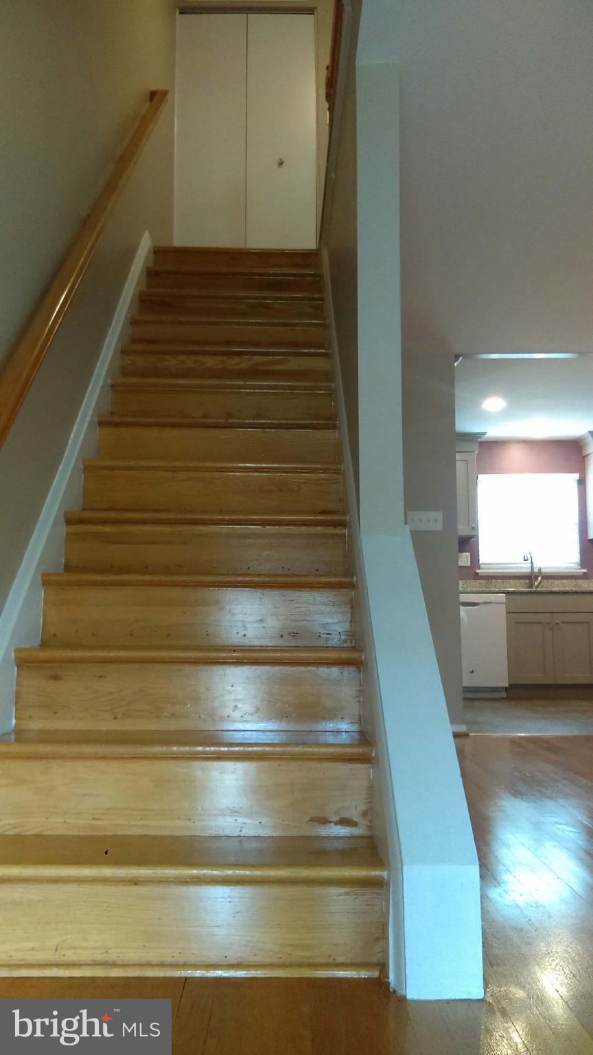 5659 Chelwynd Road Baltimore, MD 21227 - Photo 2 of 30 Harwood floors and stairs.