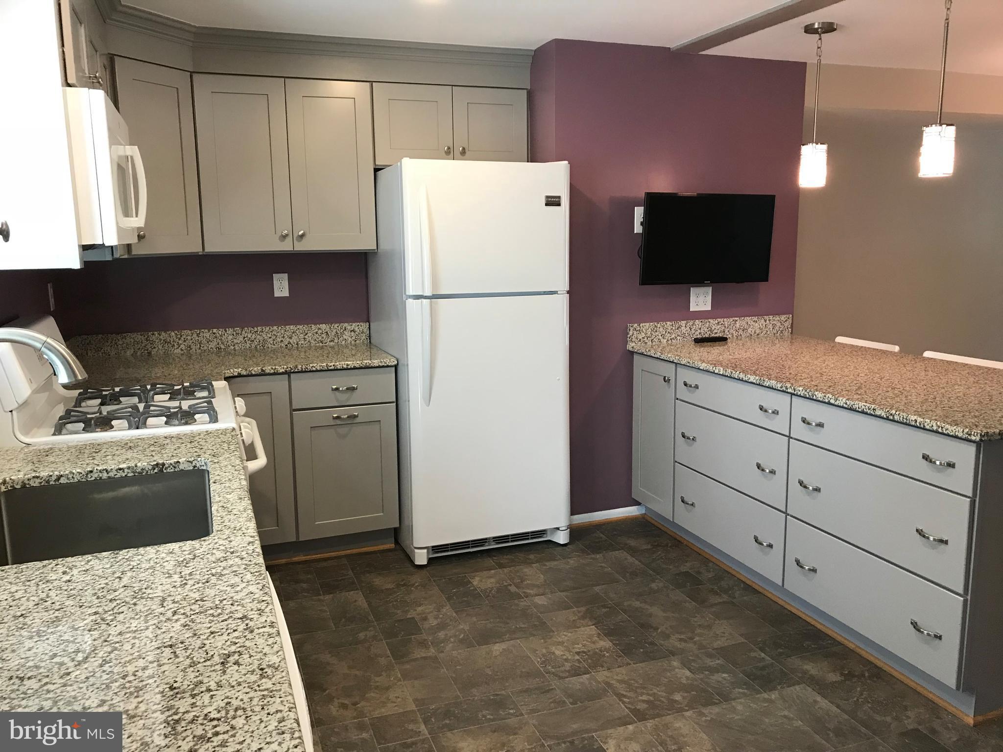 5659 Chelwynd Road Baltimore, MD 21227 - Photo 11 of 30 Plenty of counter space and storage shelves