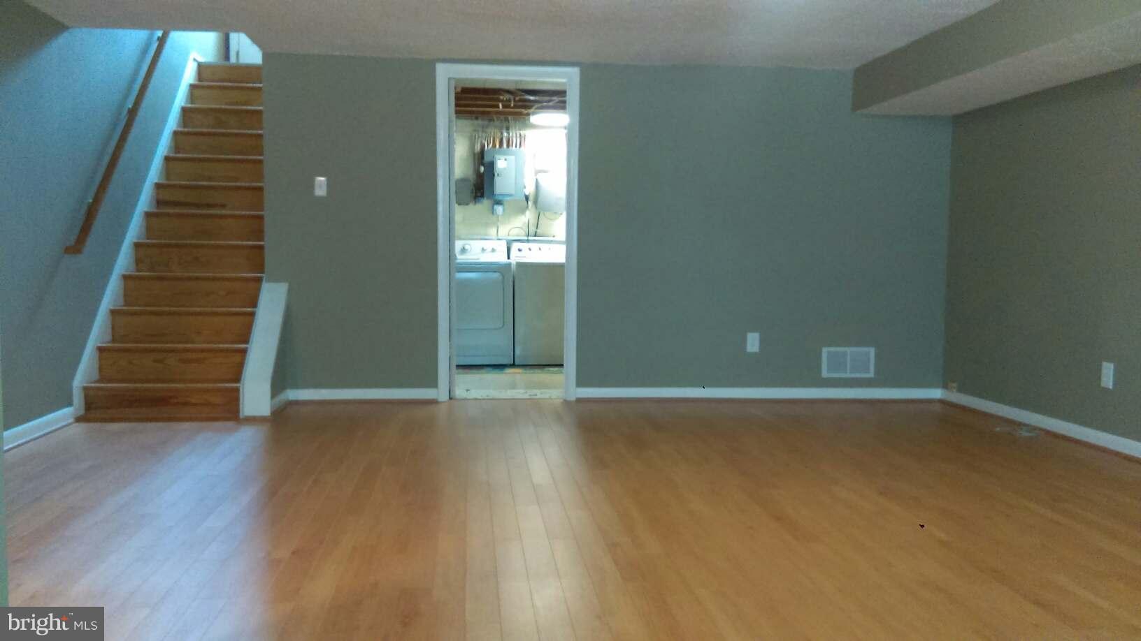 5659 Chelwynd Road Baltimore, MD 21227 - Photo 23 of 30 Large Recreation Room, Hardwood Stairs