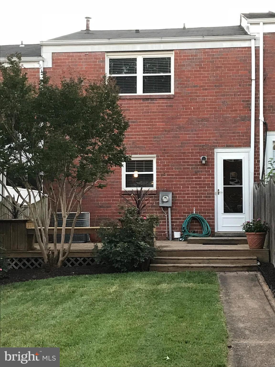5659 Chelwynd Road Baltimore, MD 21227 - Photo 28 of 30 Brick Exterior, Deck and Lawn in Fenced Backyard