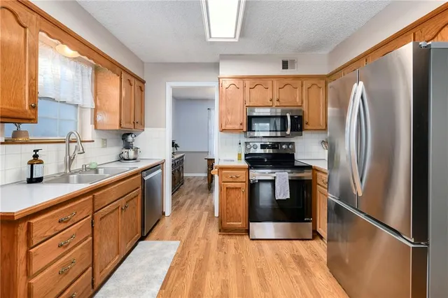 $310,000 | 2504 Northwest Leann Drive, Blue Springs, MO 64014