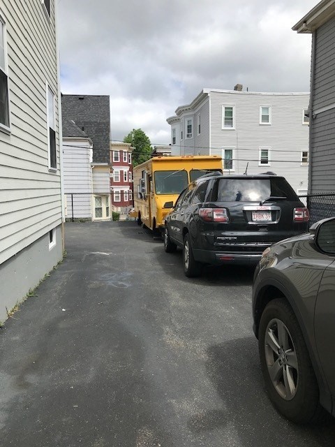 157-159 Fuller Street Boston, MA 02124 - Photo 3 of 19 a car parked in front of a house