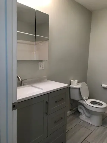 a view of kitchen with cabinets