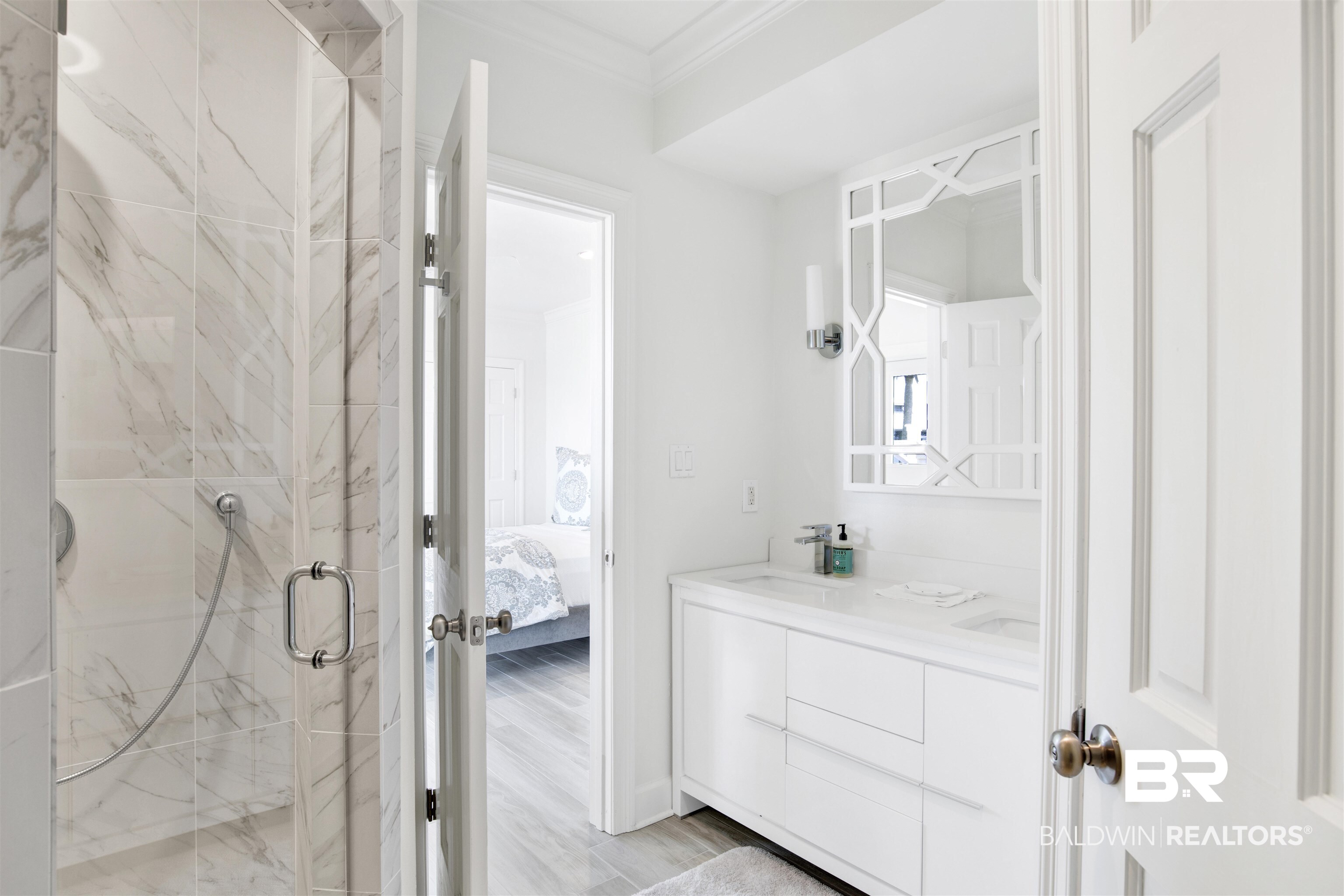 33400 River Road Orange Beach, AL 36561 - Photo 49 of 72 Bathroom featuring a shower with shower door, hardwood / wood-style floors, vanity, and ornamental molding
