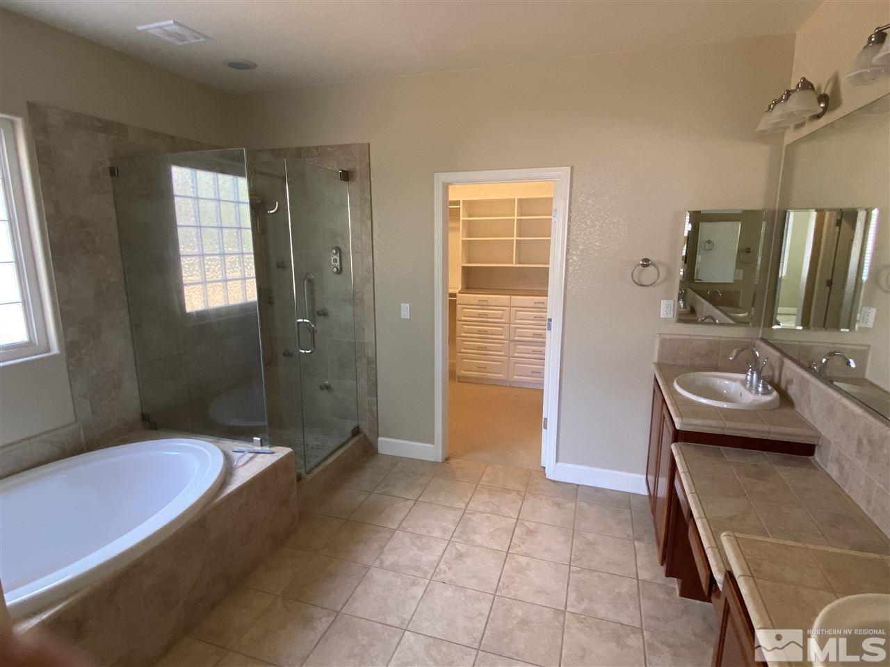 8145 Willow Ranch Trail Reno, NV 89523 - Photo 16 of 31 a bathroom with a sink a toilet and shower