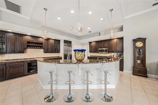 a large kitchen with stainless steel appliances