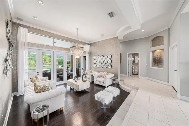 a living room with dining table and chairs