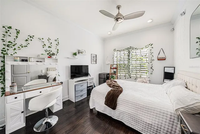 a view of a patio with a table and chairs under an umbrella