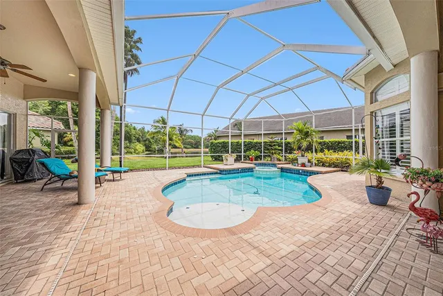 a living room with furniture and chandelier
