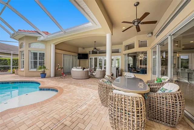 a view of a house with pool and porch