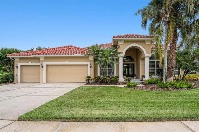 an aerial view of residential houses with outdoor space and river view