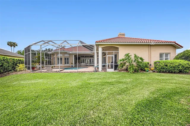 a view of a swimming pool with a yard
