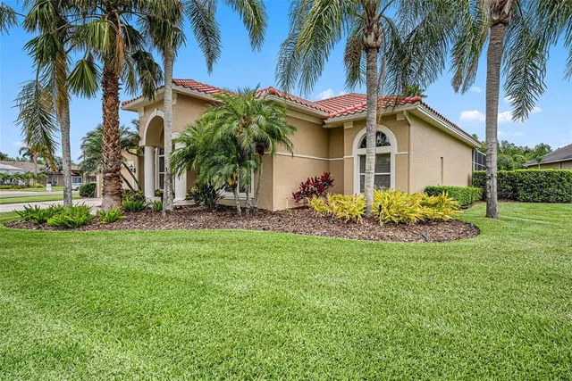 a view of a lake with houses in the back
