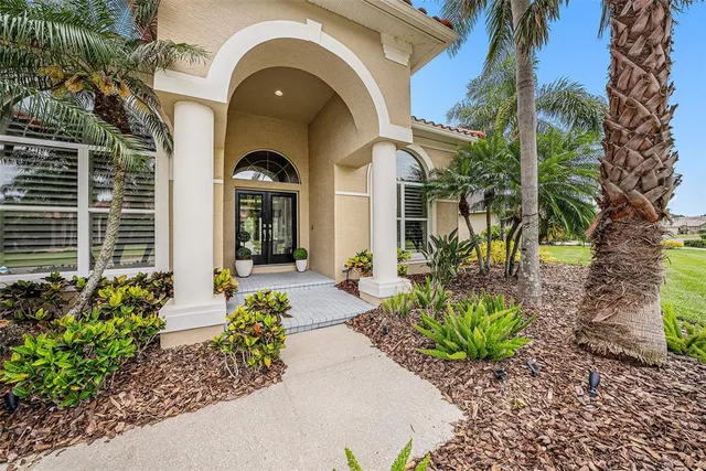 a view of kitchen with stainless steel appliances kitchen island granite countertop a table and chairs in it