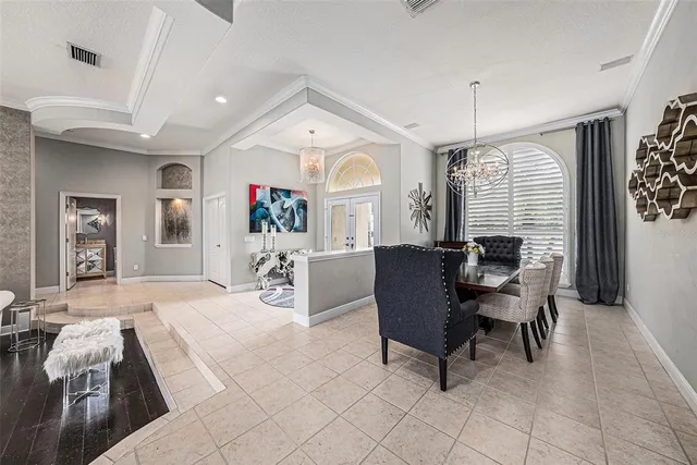 a view of a workspace with furniture and wooden floor