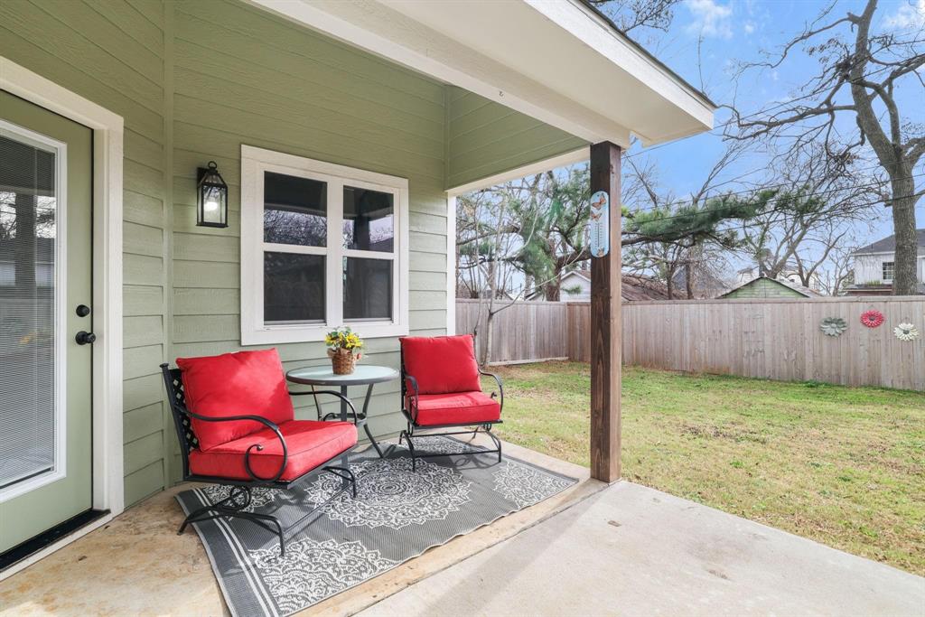 114 West Morton Street Denison, TX 75021 - Photo 20 of 21 a backyard of a house with seating space
