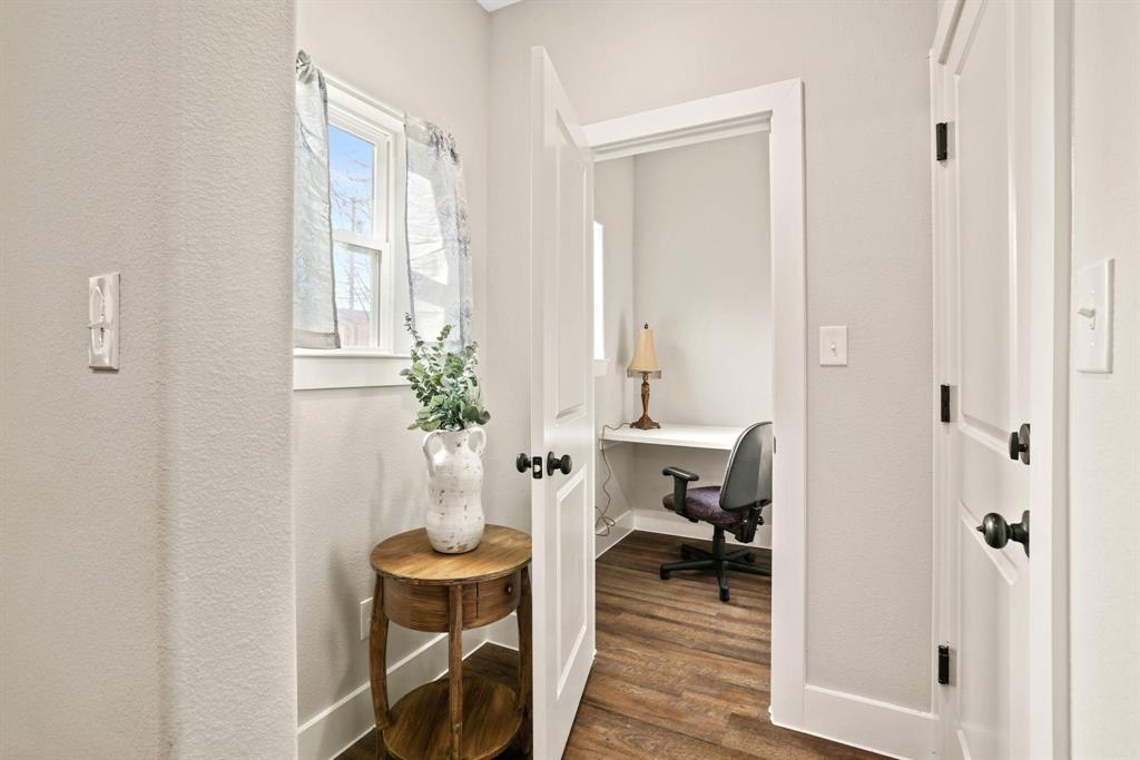 114 West Morton Street Denison, TX 75021 - Photo 5 of 21 a view of a workspace with furniture and a potted plant