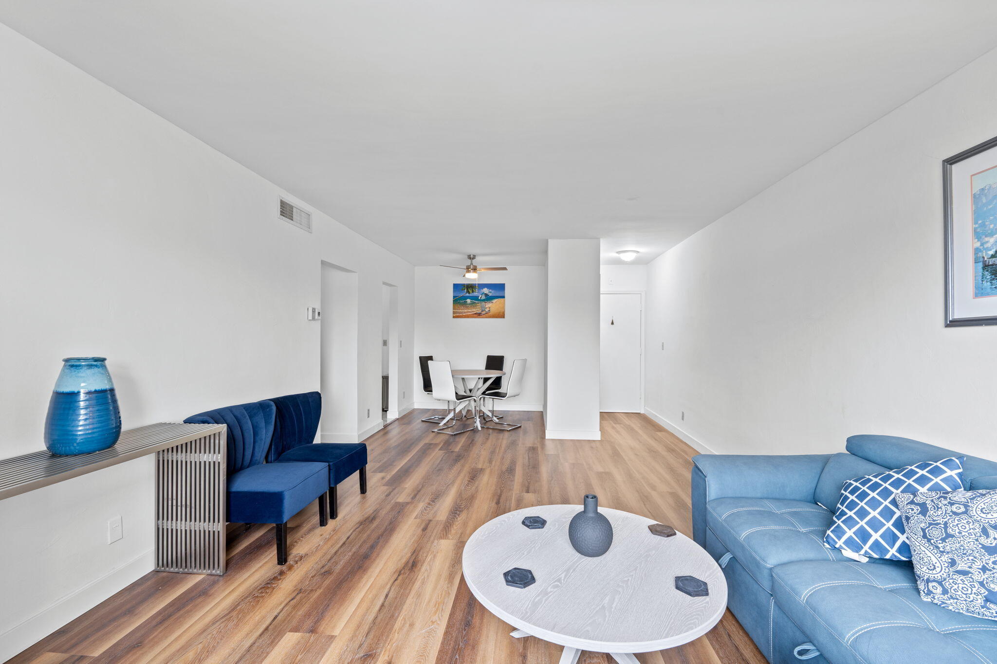 418 South Cypress Road, Unit 128 Pompano Beach, FL 33060 - Photo 14 of 49 a living room with furniture and a wooden floor
