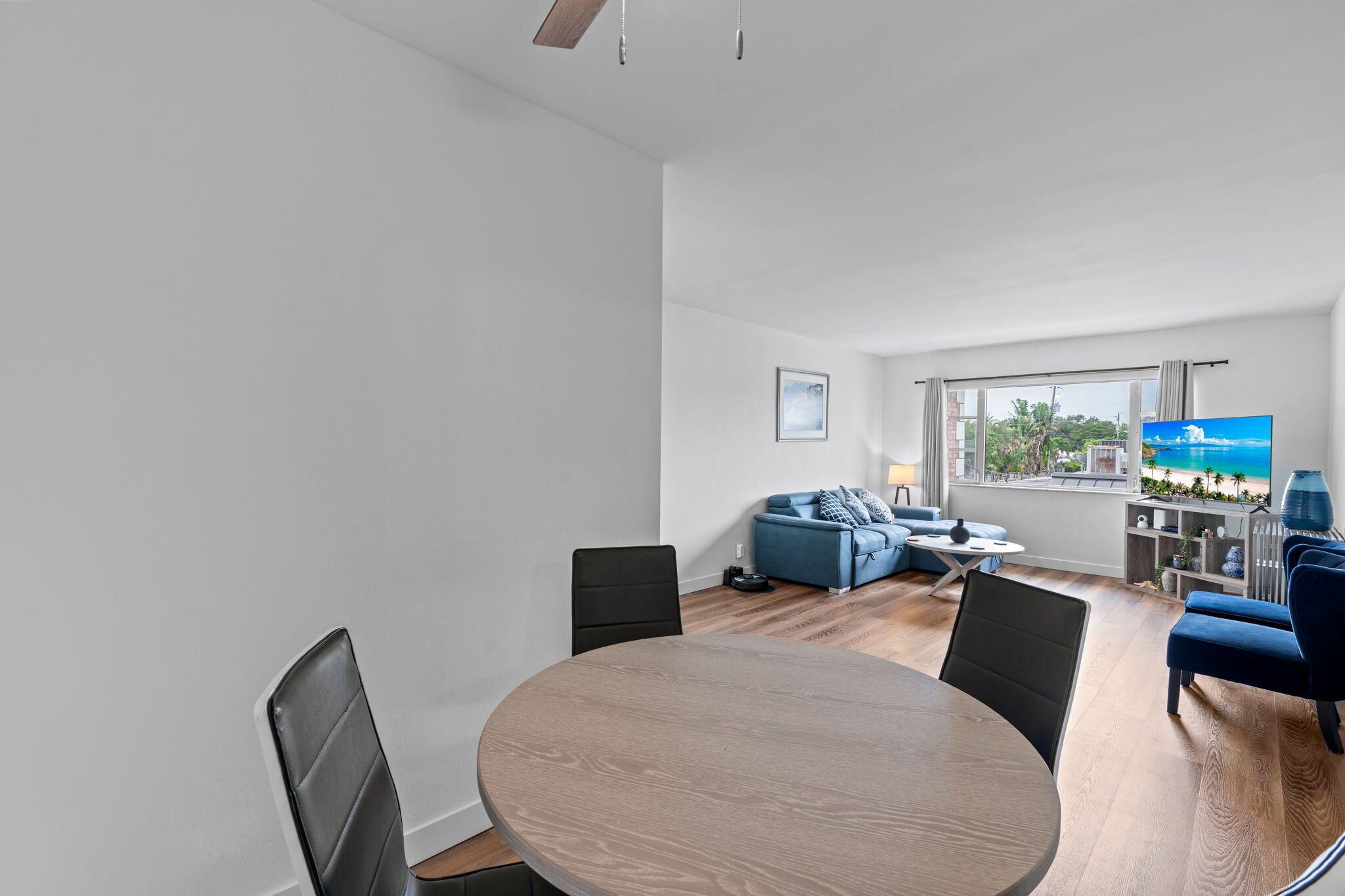 418 South Cypress Road, Unit 128 Pompano Beach, FL 33060 - Photo 15 of 49 a living room with furniture a window and a table