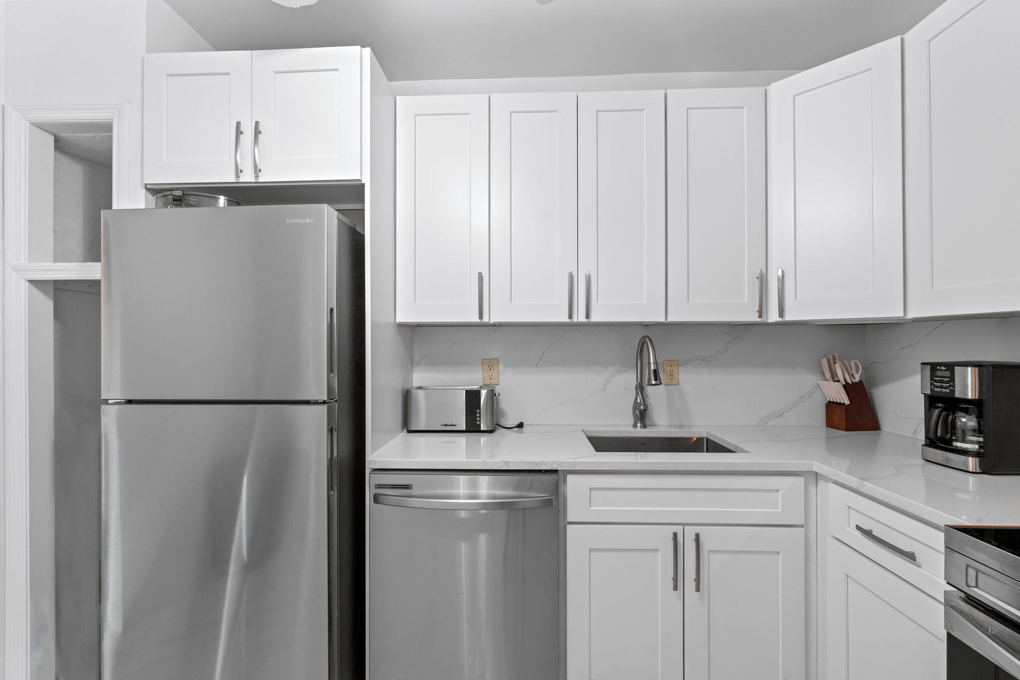 418 South Cypress Road, Unit 128 Pompano Beach, FL 33060 - Photo 18 of 49 a white refrigerator freezer sitting in a kitchen