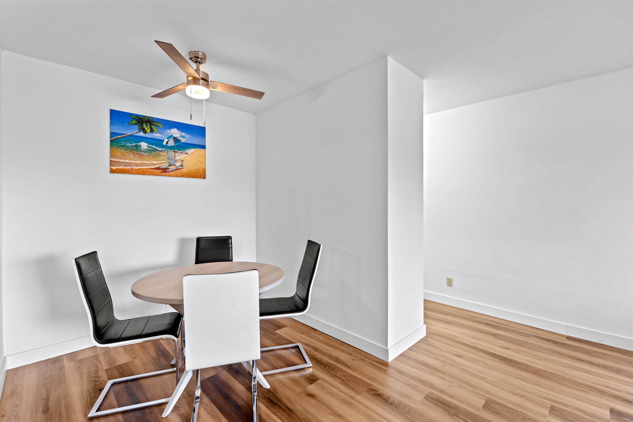 418 South Cypress Road, Unit 128 Pompano Beach, FL 33060 - Photo 19 of 49 a view of a dining room with furniture and wooden floor
