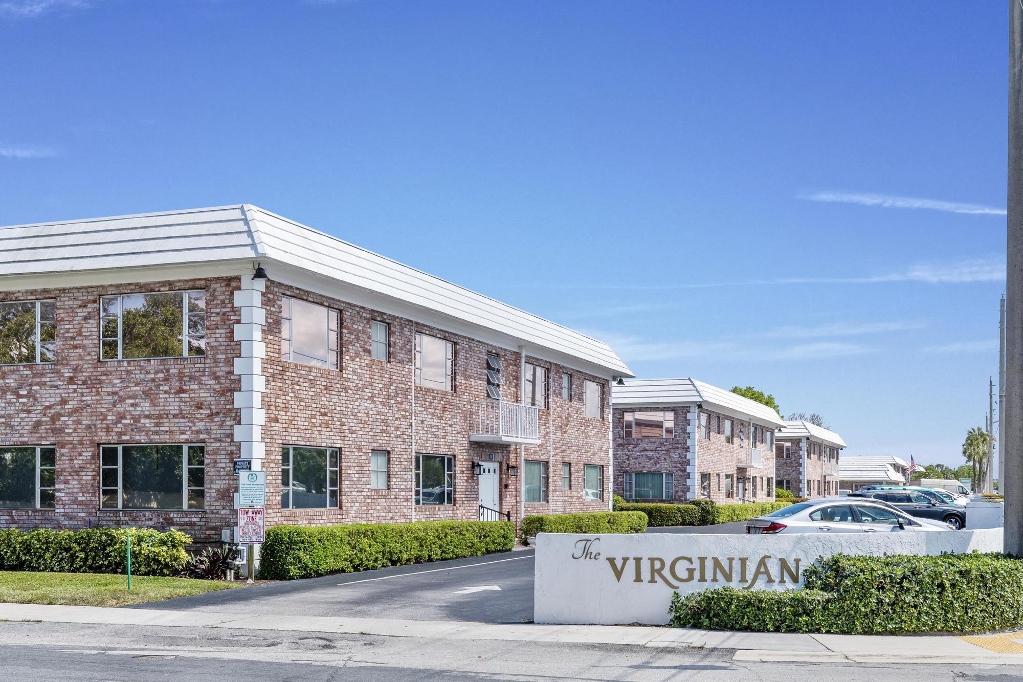 418 South Cypress Road, Unit 128 Pompano Beach, FL 33060 - Photo 2 of 49 a view of a building next to a yard